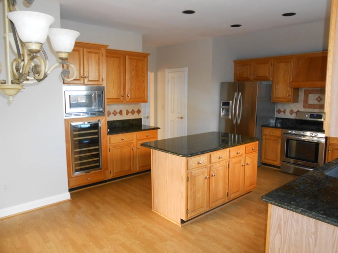 Kitchen before renovation - outdated cabinets and layout